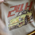 Beige tote bag with a graphic of a vintage race car and '24H' text on a blurred background